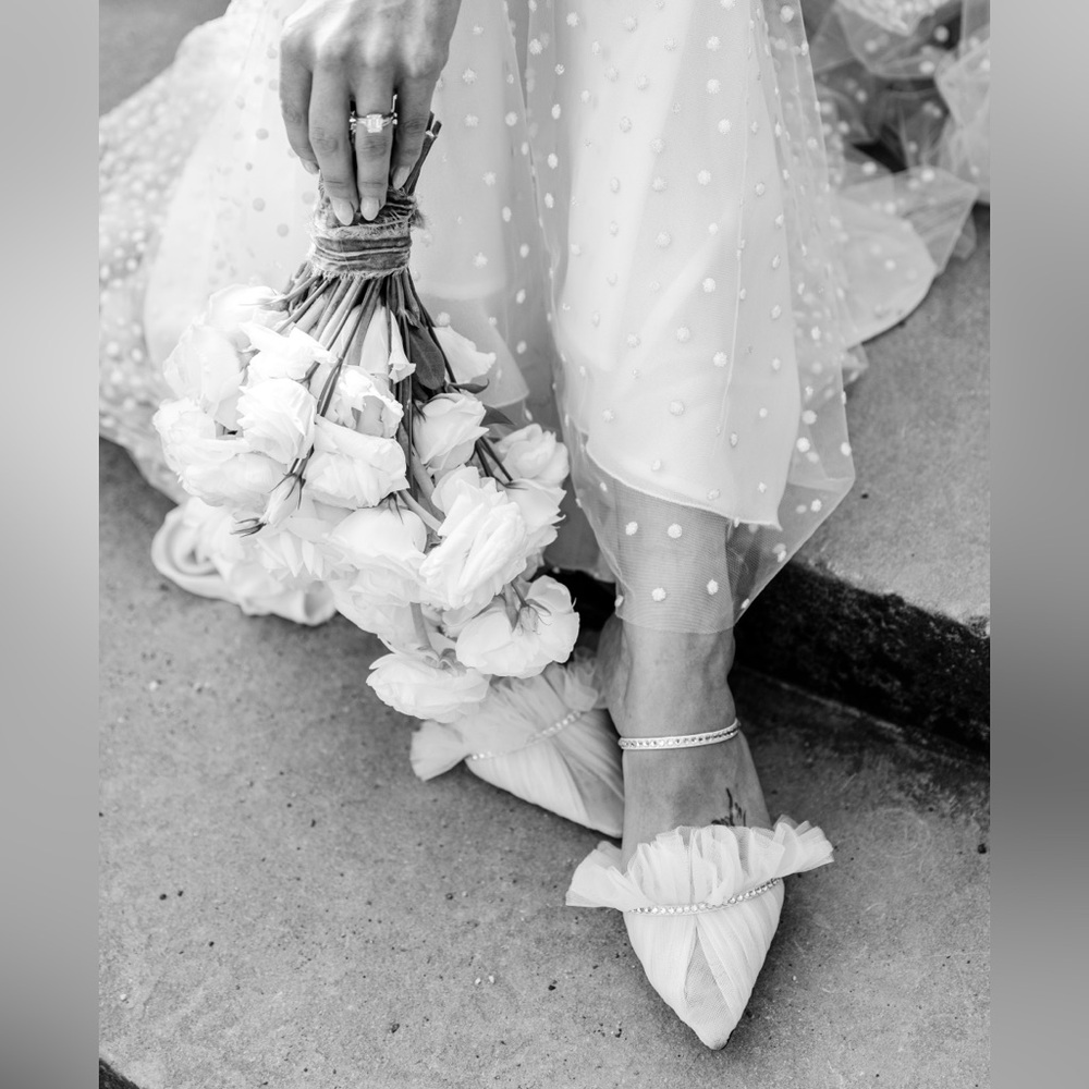 Andrea Wazen Kaya mules in white